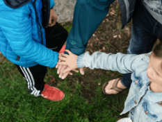 Family with hands together.