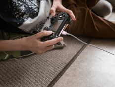 Photo of boy playing video games