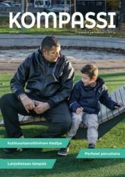 Kompassi 2/2026 -lehden kansi. Kansikuvassa aikuinen ja lapsi istumassa puistossa.